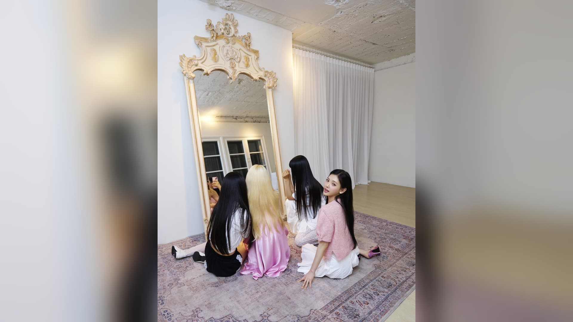 Baby DONT Cry members posing in front of a mirror during a promotional photoshoot