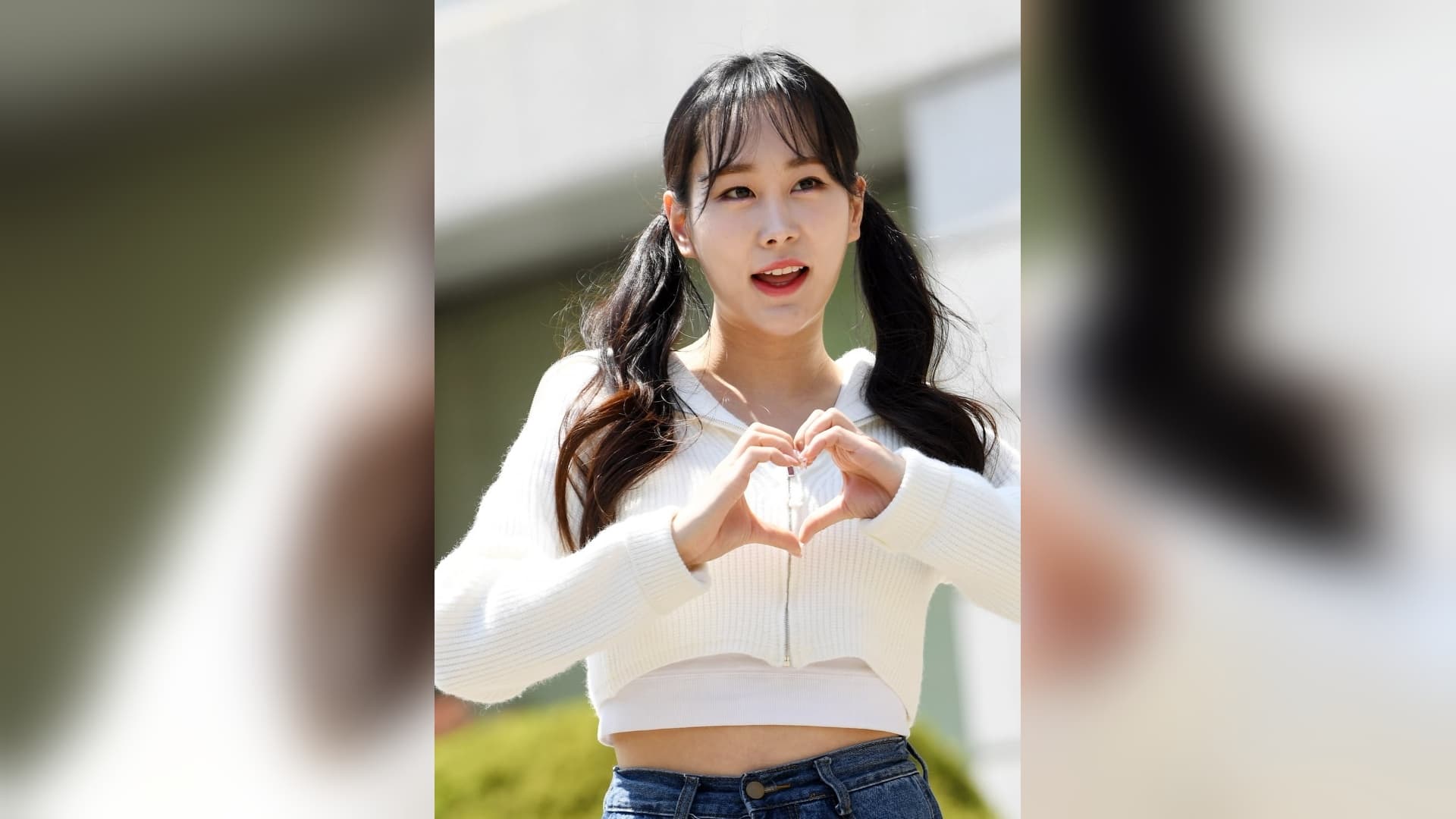 Trot singer Kim Ui-young making a heart gesture at a public event