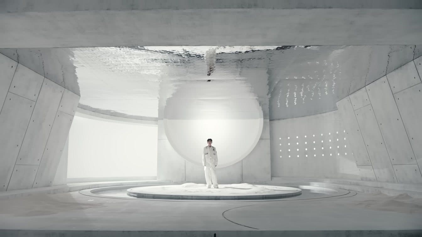 Lim Young-woong in white outfit on a circular stage platform from his official music video — YouTube: 임영웅