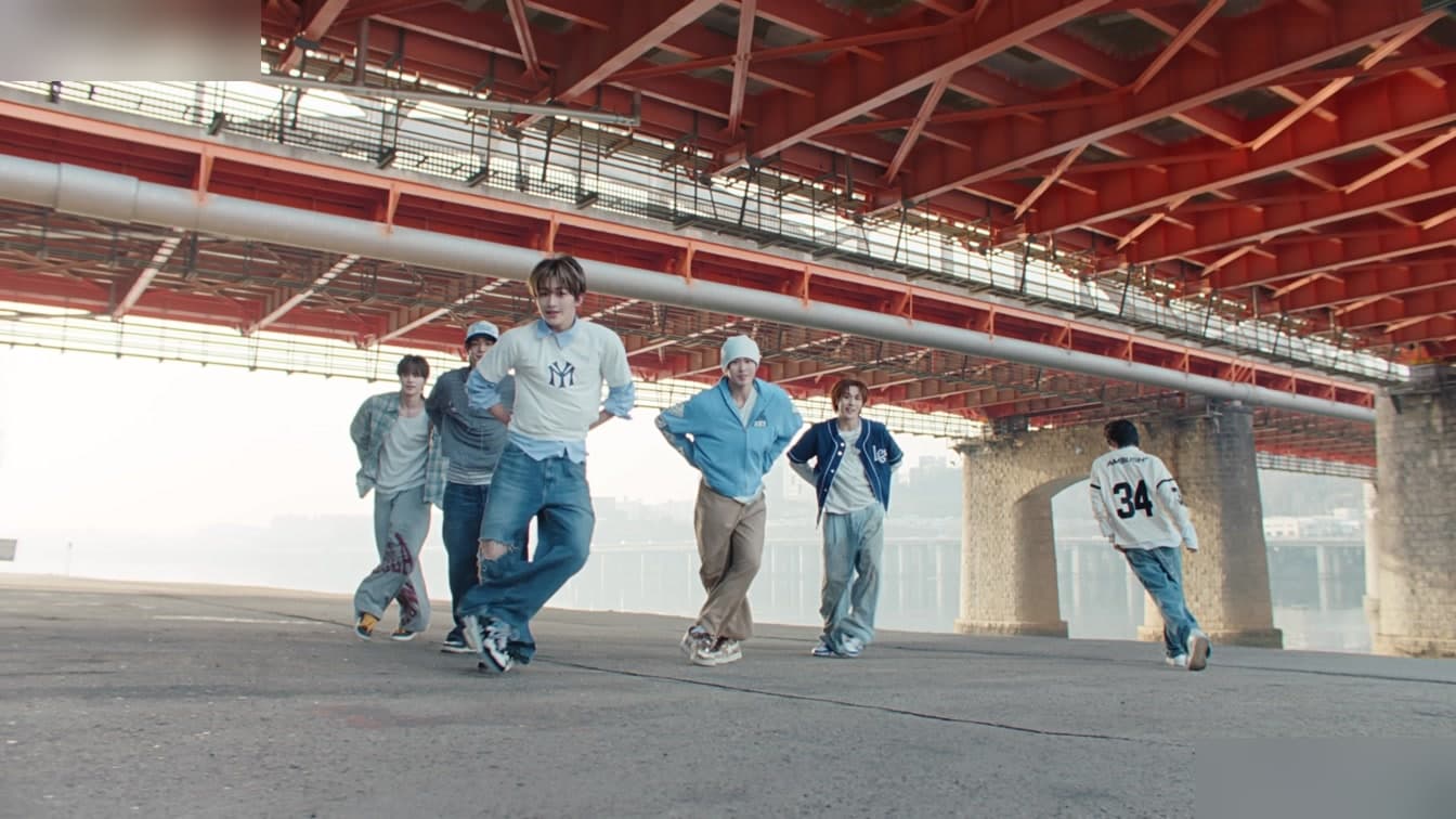 A vibrant concert performance capturing the energy of a K-pop act on a major festival stage